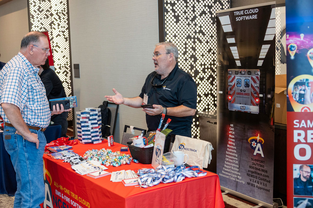 exhibitor interacting with attendee during exhibit hours | Texas EMS Medical Director Conference